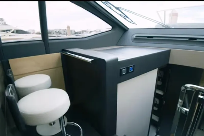 Slide: The Image of Interior of 2017 Azimut 66 yacht with modern seating and sleek design. - 14