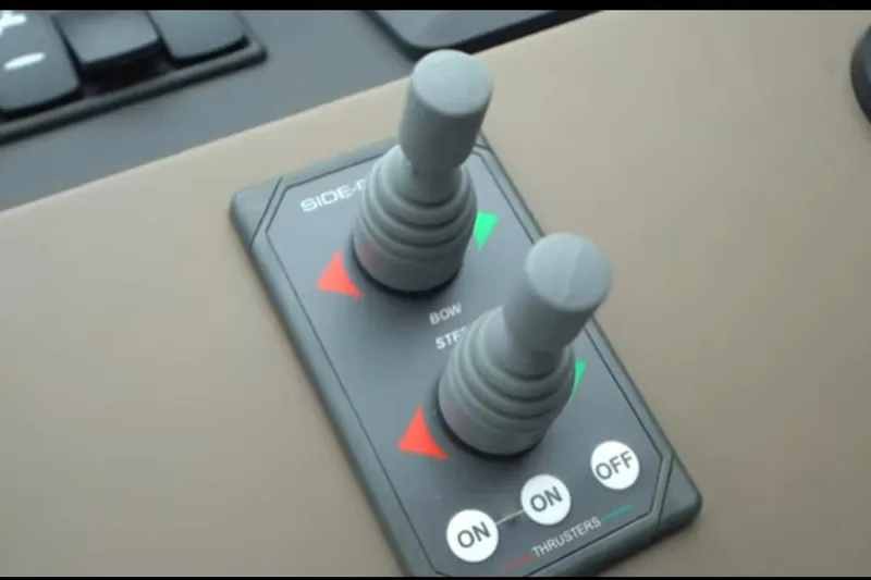 Slide: The Image of Control panel of a 2017 Azimut 66 yacht with bow and stern thruster joysticks. - 15