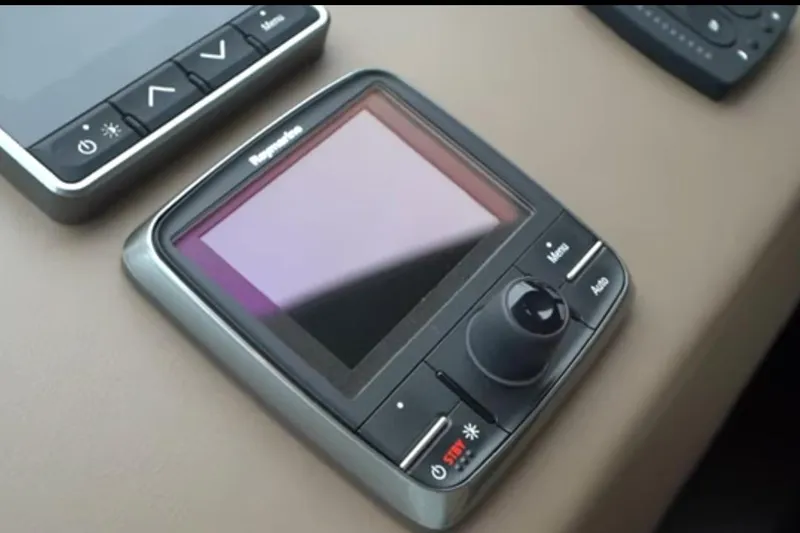 Slide: The Image of Control panel on 2017 Azimut 66 yacht dashboard, featuring navigation and adjustment buttons. - 17