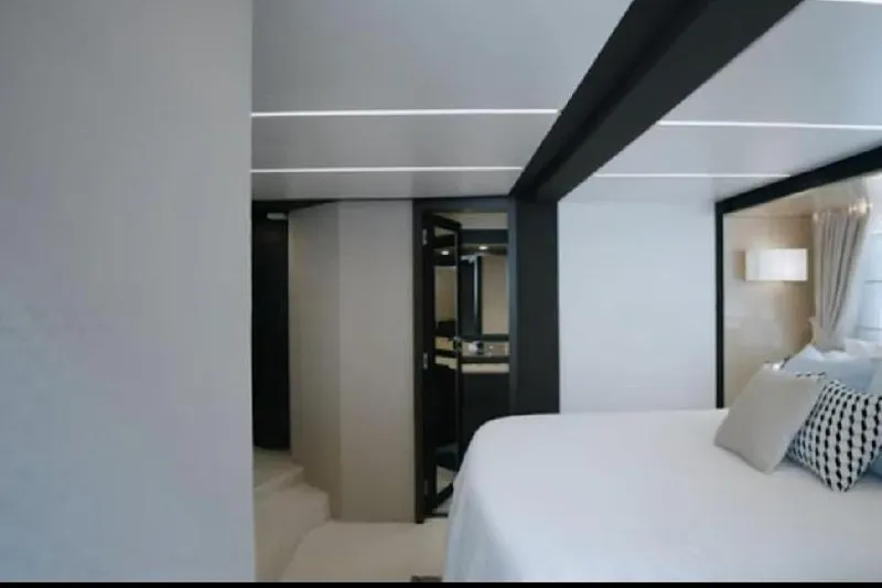 Slide: The Image of Luxurious interior of 2017 Azimut 66 yacht, featuring modern bedroom design and elegant decor. - 18