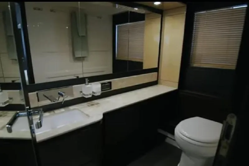 Slide: The Image of Luxurious bathroom in 2017 Azimut 66 yacht with modern fixtures and elegant design. - 20