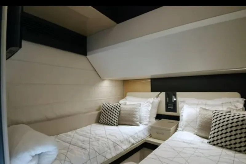 Slide: The Image of Luxurious twin cabin interior of 2017 Azimut 66 yacht with elegant bedding and modern design. - 22