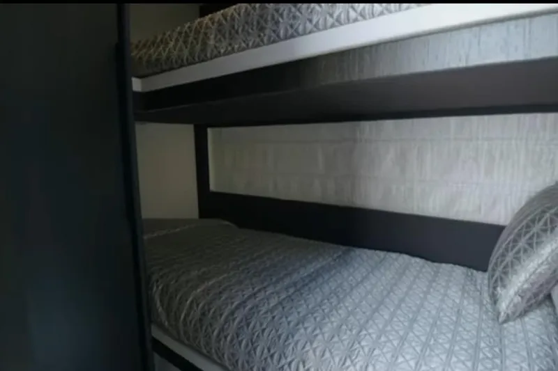 Slide: The Image of Bunk beds with patterned bedding in 2017 Azimut 66 yacht interior. - 23