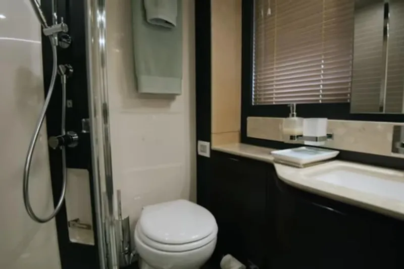 Slide: The Image of Luxurious bathroom in 2017 Azimut 66 yacht with modern fixtures and elegant design. - 24