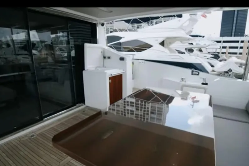Slide: The Image of Luxurious 2017 Azimut 66 yacht deck with sleek design and modern amenities. - 4