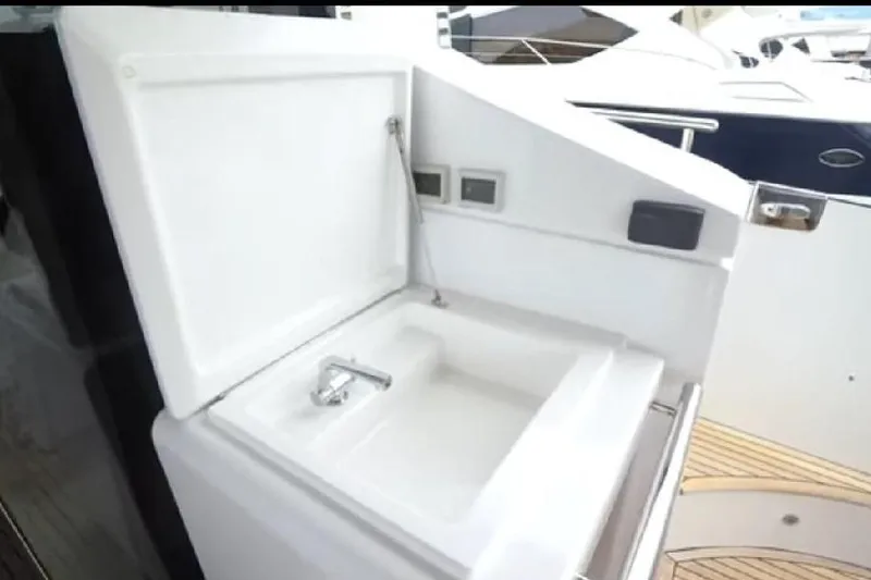 Slide: The Image of Outdoor sink on 2017 Azimut 66 yacht, featuring sleek design and modern fixtures. - 5