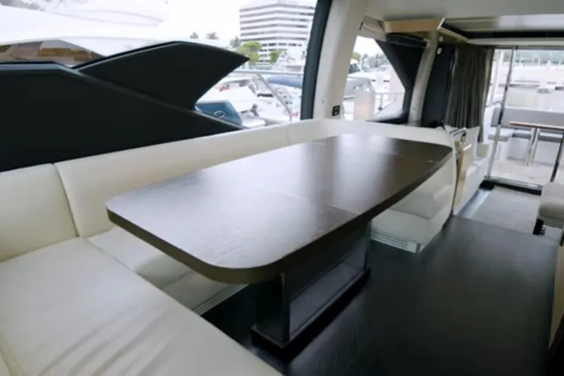 Slide: The Image of Luxurious interior of 2017 Azimut 66 yacht with elegant dining area and modern furnishings. - 9