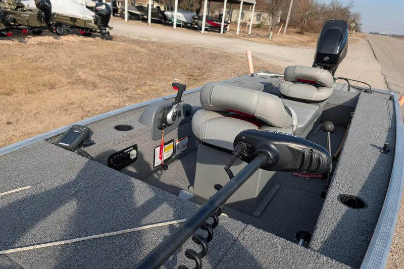 Slide: The Image of 2017 Tracker Panfish 16 boat interior with seats and control panel. - 16