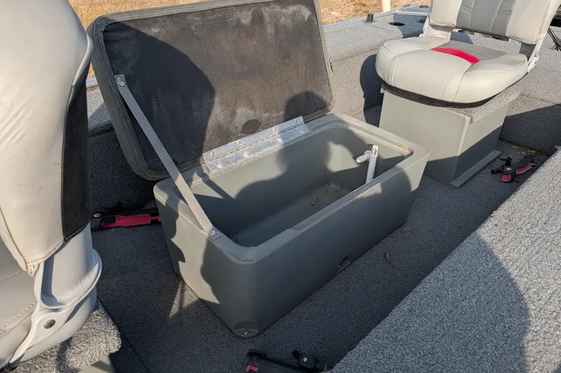 Slide: The Image of 2017 Tracker Panfish 16 boat interior with open storage compartment and seating. - 19