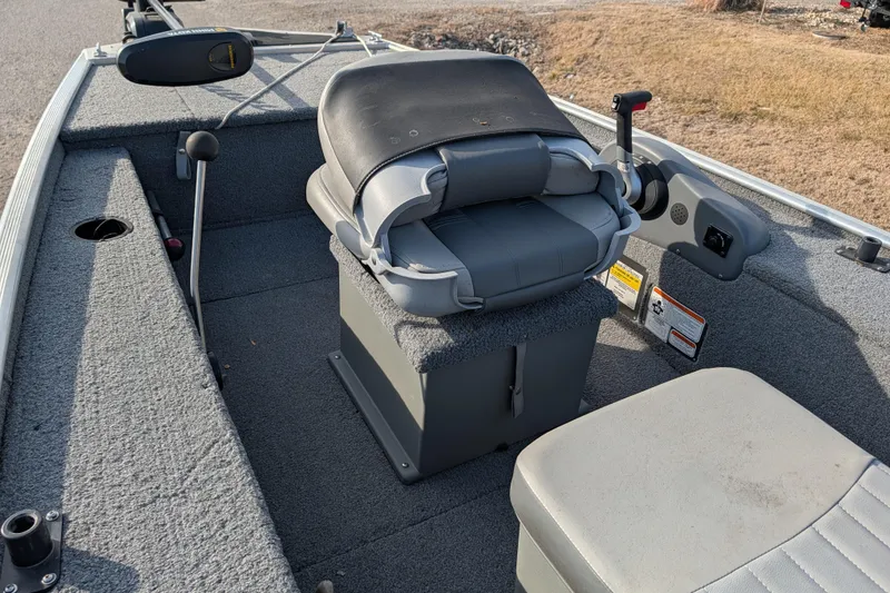 Slide: The Image of 2017 Tracker Panfish 16 boat interior with seating and controls. - 20