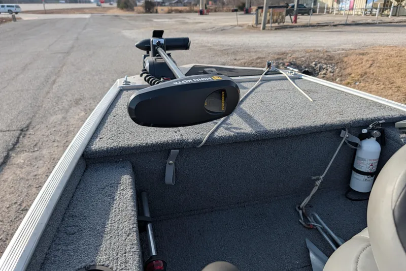 Slide: The Image of 2017 Tracker Panfish 16 boat interior with trolling motor and fire extinguisher. - 21