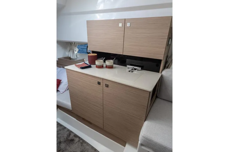 Slide: The Image of Manufacturer Provided Image: 2026 Jeanneau Leader 9.0 WA Series 2 interior with modern cabinetry and compact sink. - 18
