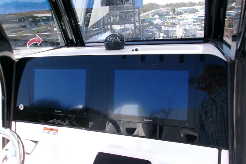 Slide: The Image of Dashboard of 2026 Sportsman Masters 267OE Bay Boat with dual Garmin displays. - 10