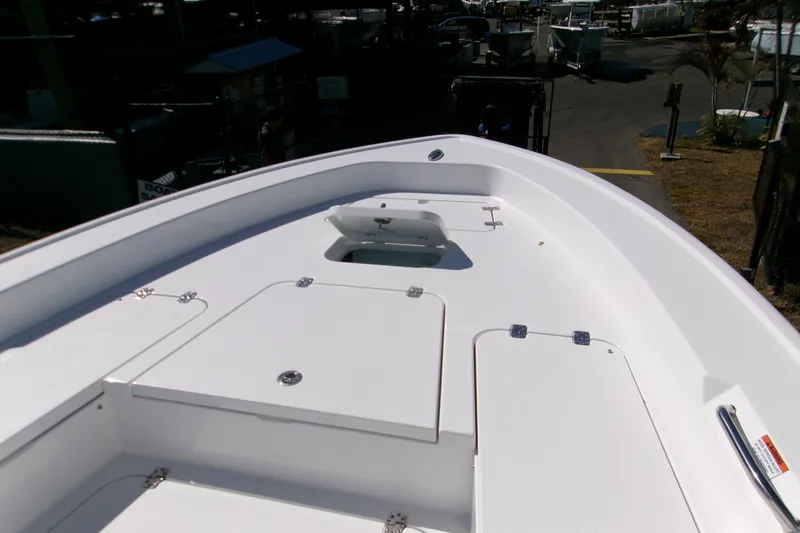 Slide: The Image of 2026 Sportsman Masters 267OE Bay Boat deck with storage compartments. - 12