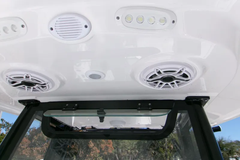 Slide: The Image of 2026 Sportsman Masters 267OE Bay Boat interior with speakers and LED lights. - 14