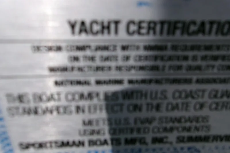 Slide: The Image of Blurry yacht certification label for 2026 Sportsman Masters 267OE Bay Boat. - 15