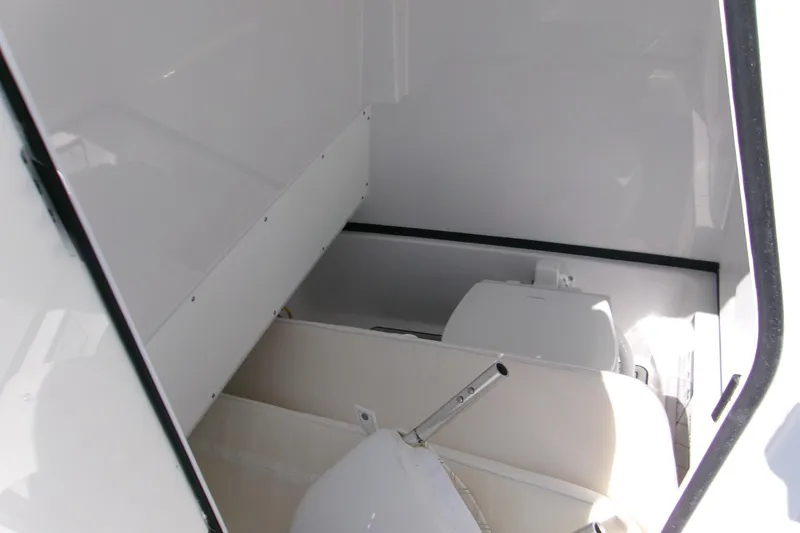 Slide: The Image of 2026 Sportsman Masters 267OE Bay Boat interior storage compartment. - 16