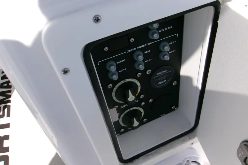 Slide: The Image of Control panel of 2026 Sportsman Masters 267OE Bay Boat, featuring circuit protection switches. - 17