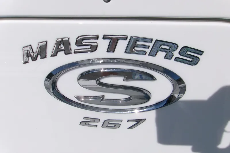 Slide: The Image of 2026 Sportsman Masters 267OE Bay Boat logo on white surface. - 19