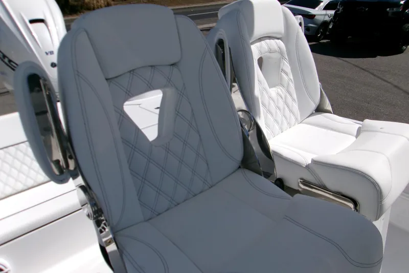 Slide: The Image of Luxurious seating on 2026 Sportsman Masters 267OE Bay Boat with diamond stitching. - 9