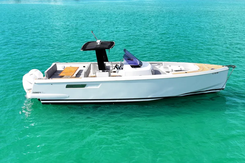 The Image of 2018 Fjord 36 Xpress boat on clear turquoise water, side view. - 0