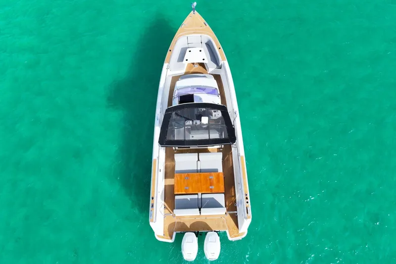 Slide: The Image of Aerial view of 2018 Fjord 36 Xpress boat on turquoise water. - 10