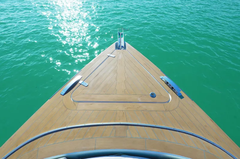 Slide: The Image of Bow of 2018 Fjord 36 Xpress yacht on clear turquoise water. - 13