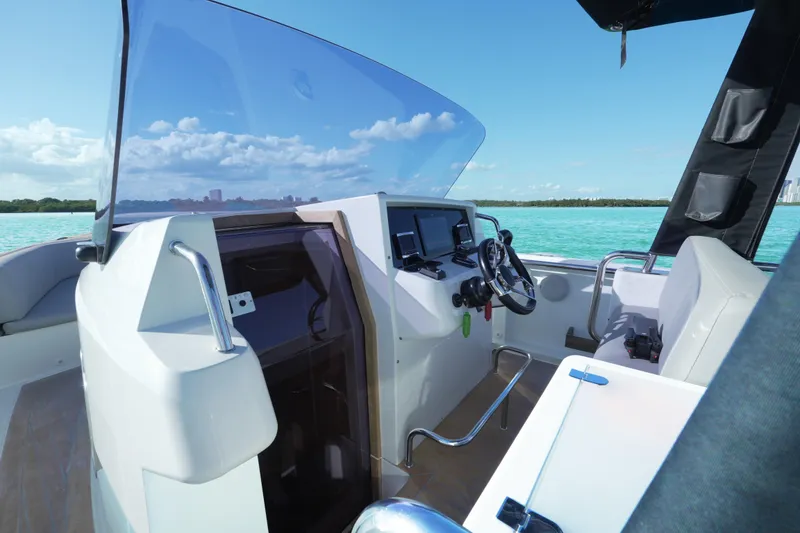Slide: The Image of 2018 Fjord 36 Xpress boat cockpit with modern controls and ocean view. - 17