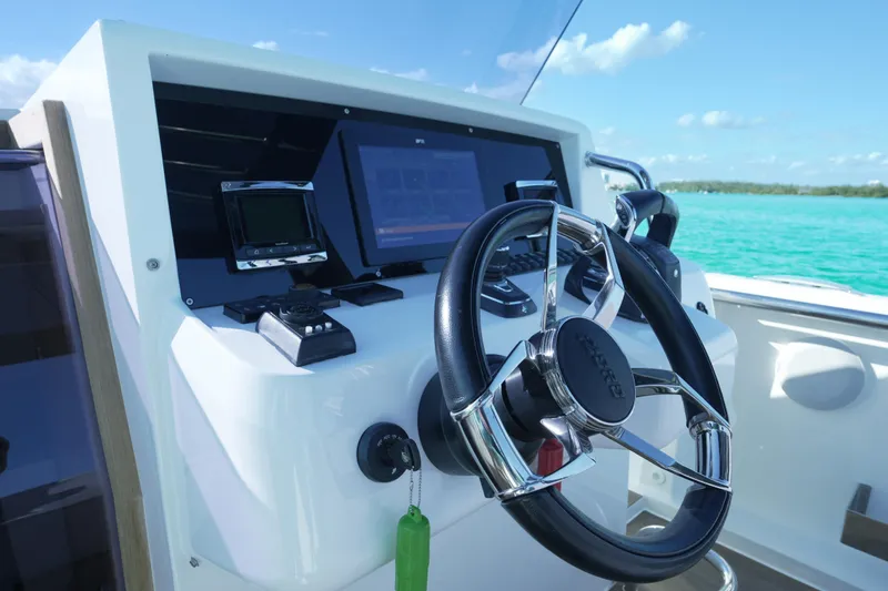 Slide: The Image of Steering console of 2018 Fjord 36 Xpress boat with modern navigation equipment. - 18