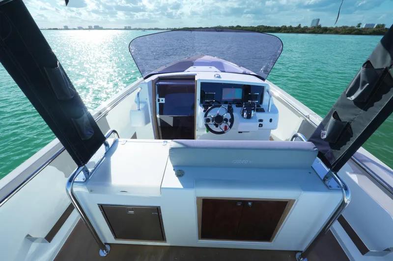 Slide: The Image of 2018 Fjord 36 Xpress boat helm with scenic ocean view. - 27