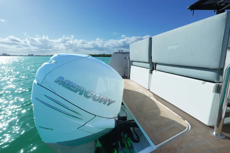 Slide: The Image of 2018 Fjord 36 Xpress boat with Mercury engine on turquoise water. - 35