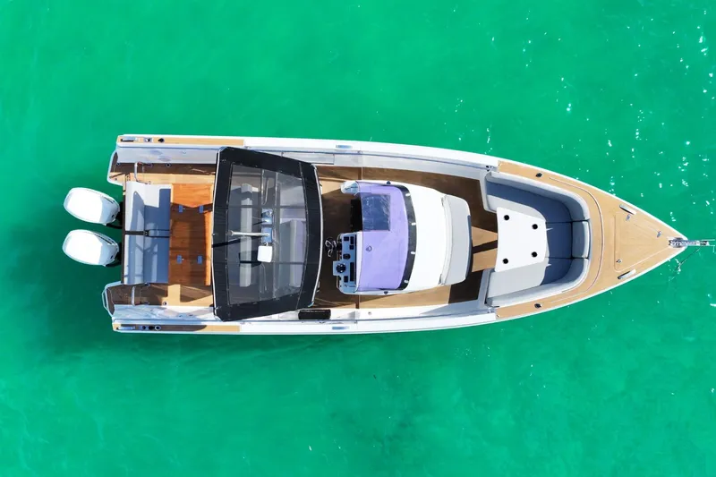Slide: The Image of Aerial view of 2018 Fjord 36 Xpress boat on turquoise water. - 8