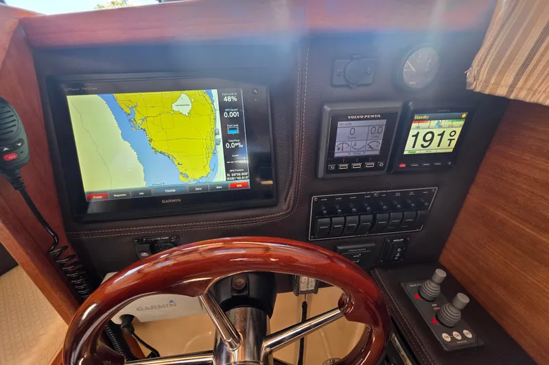 Slide: The Image of 2017 Ranger Tugs R-27 helm with Garmin navigation and control panels. - 9