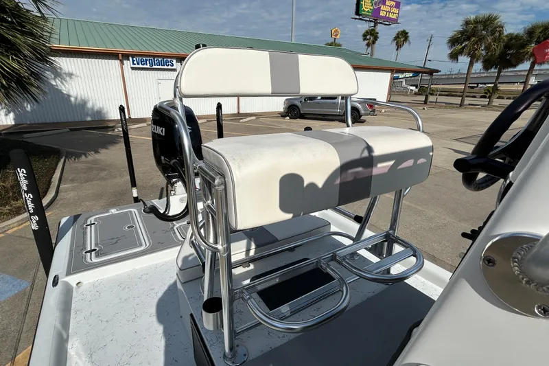 Slide: The Image of 2023 Shallow Stalker Cat 240 Elite boat with Suzuki engine, parked near Everglades building. - 14