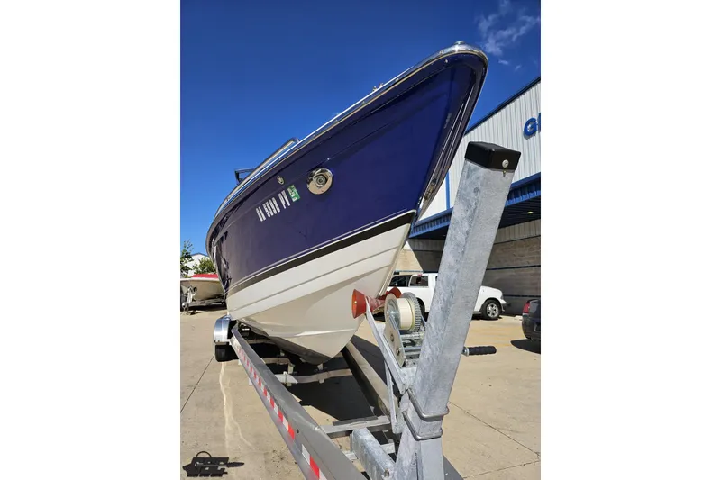 Slide: The Image of 2009 Formula 353 FASTech boat on trailer, blue hull, sunny day. - 17