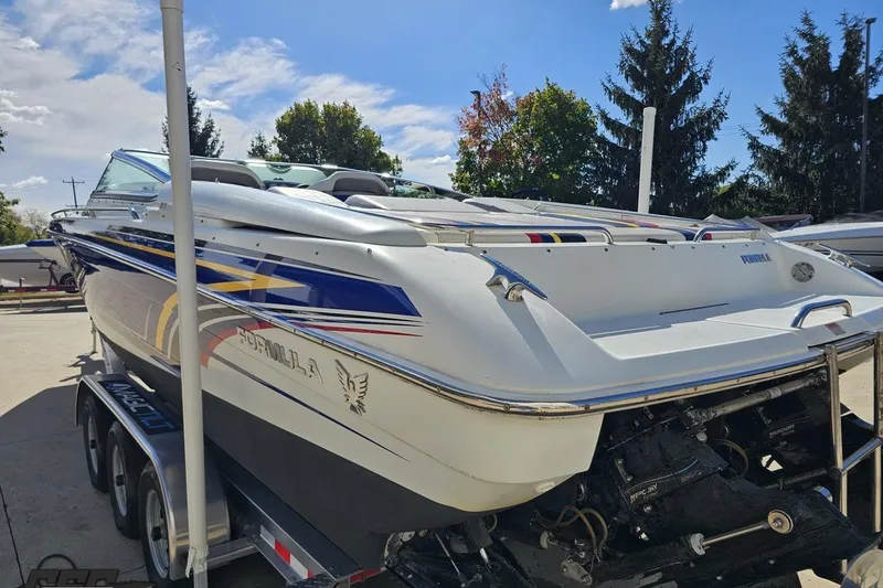 Slide: The Image of 2009 Formula 353 FASTech boat on trailer, featuring sleek design and vibrant graphics. - 30