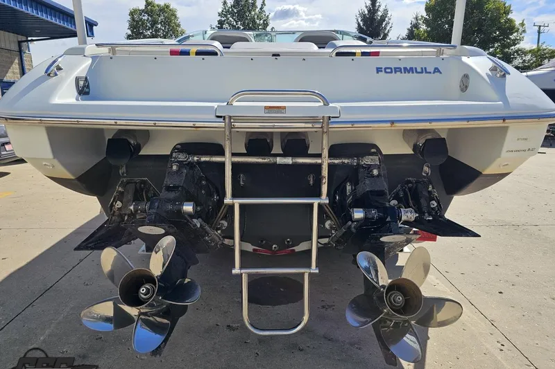 Slide: The Image of 2009 Formula 353 FASTech boat rear view with dual propellers and ladder. - 32