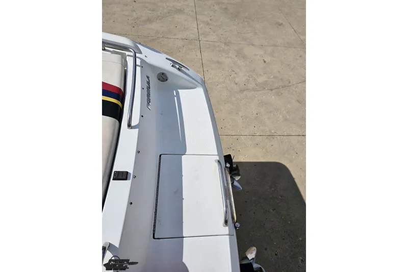Slide: The Image of 2009 Formula 353 FASTech boat rear deck, white with logo, on concrete surface. - 37