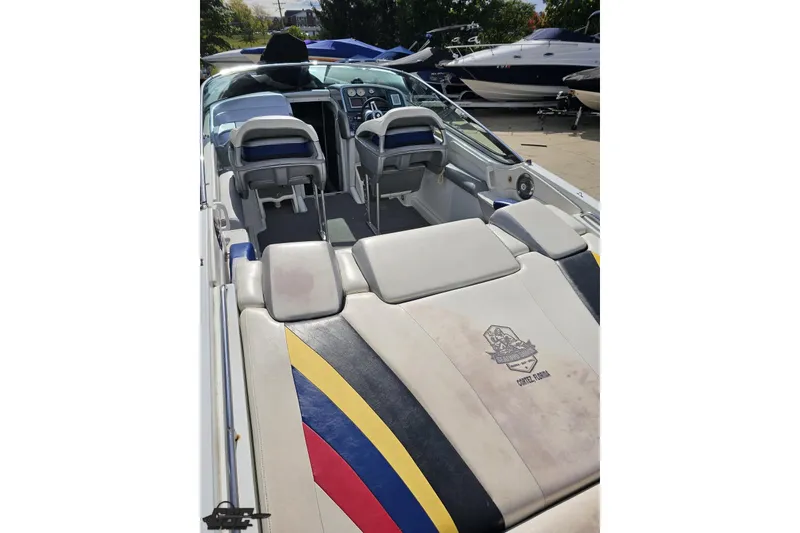 Slide: The Image of 2009 Formula 353 FASTech boat interior with colorful upholstery and dashboard view. - 38