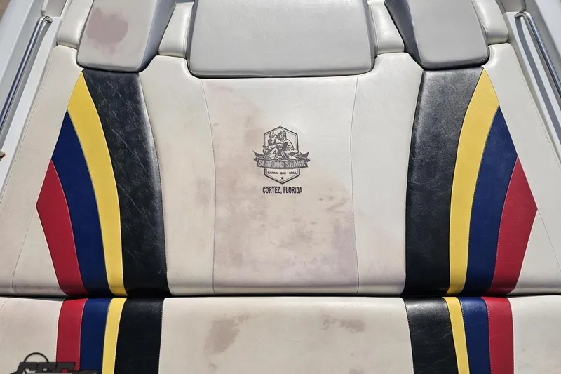 Slide: The Image of 2009 Formula 353 FASTech boat seat with colorful stripes and Cortez, Florida logo. - 41