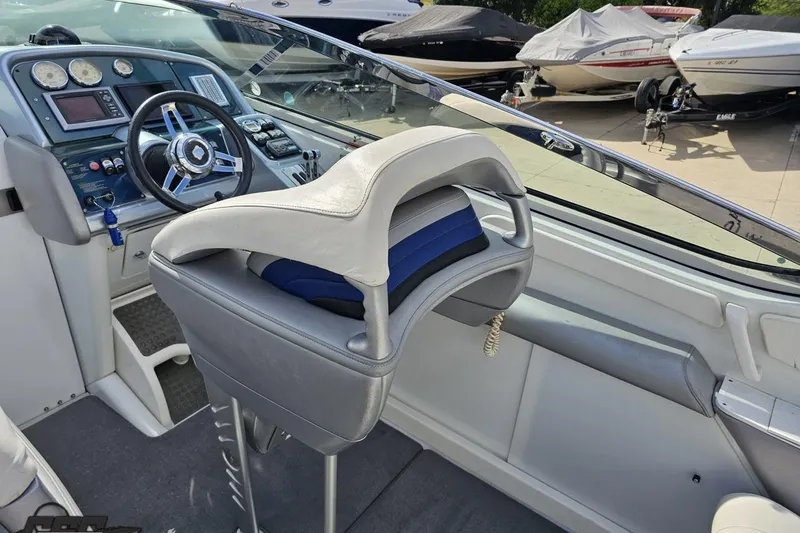 Slide: The Image of 2009 Formula 353 FASTech boat cockpit with steering wheel and control panel. - 51