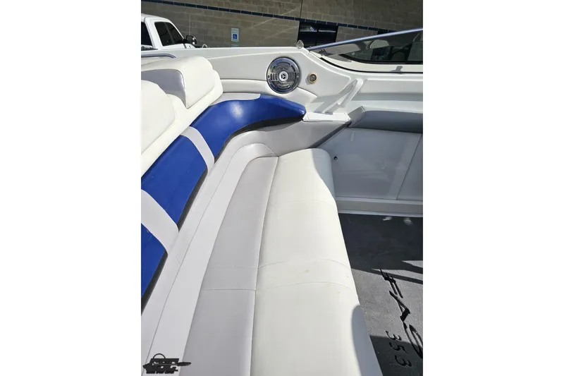 Slide: The Image of 2009 Formula 353 FASTech boat interior with white and blue seating. - 53