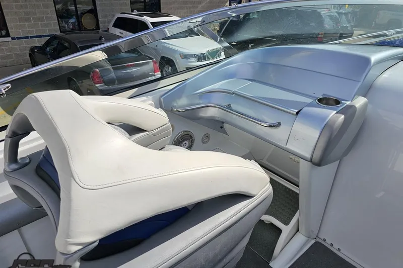 Slide: The Image of 2009 Formula 353 FASTech boat interior with white seating and sleek dashboard design. - 55