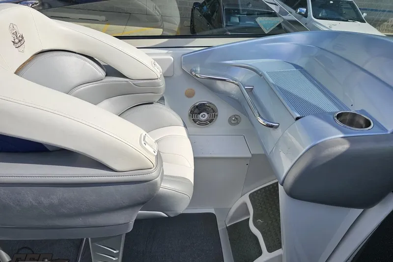Slide: The Image of 2009 Formula 353 FASTech boat interior with white leather seating and sleek dashboard design. - 58