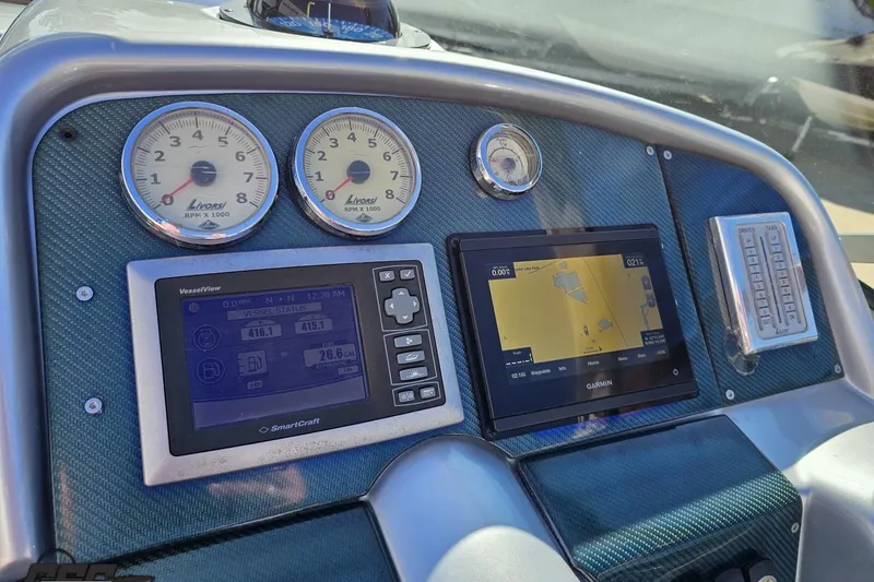 Slide: The Image of Dashboard of 2009 Formula 353 FASTech with gauges and navigation screens. - 65