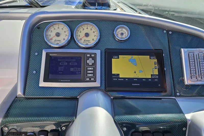 Slide: The Image of Dashboard of 2009 Formula 353 FASTech with gauges and Garmin navigation system. - 66