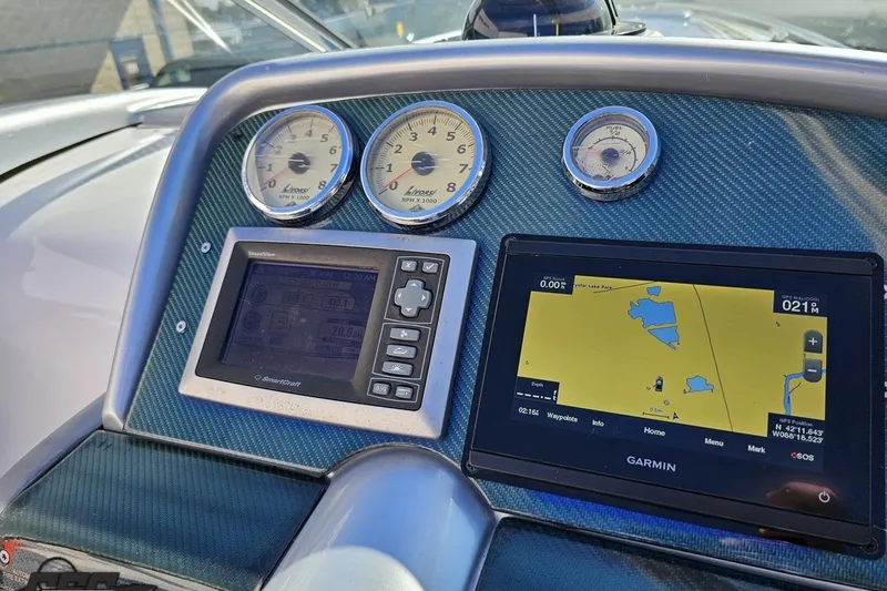 Slide: The Image of Dashboard of 2009 Formula 353 FASTech with Garmin GPS and analog gauges. - 67