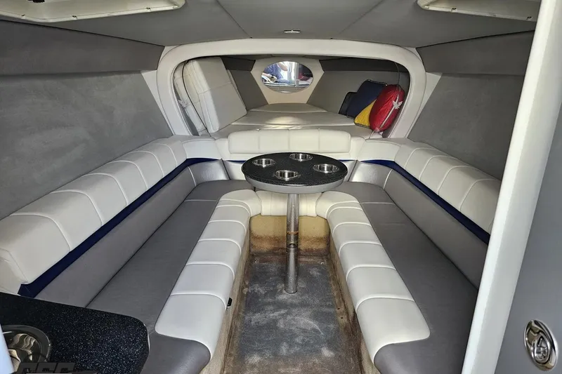 Slide: The Image of 2009 Formula 353 FASTech cabin interior with plush seating and table. - 74