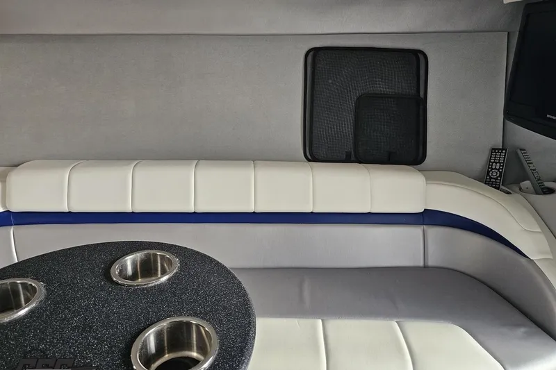 Slide: The Image of Interior of 2009 Formula 353 FASTech boat with cushioned seating and table. - 76