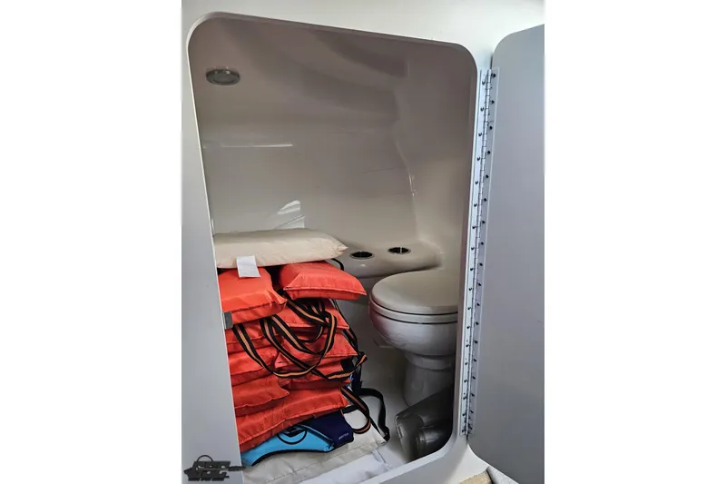 Slide: The Image of Interior of 2009 Formula 353 FASTech boat with life jackets and toilet. - 78